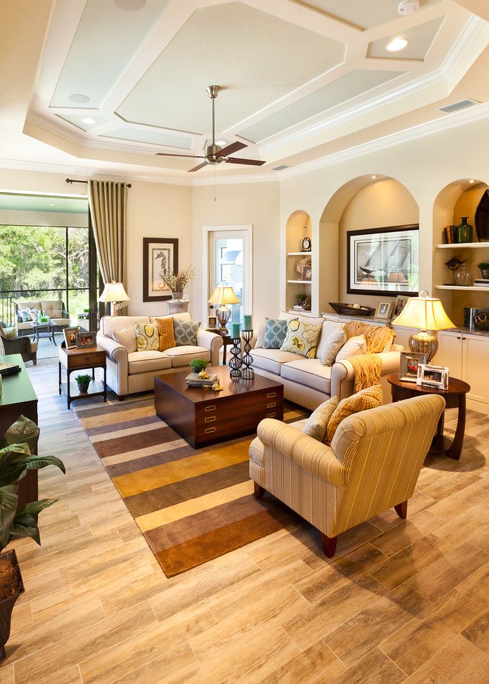 Missing Piece Tampa for a Traditional Living Room with a Ceiling Fan and the Caaren by John Cannon Homes