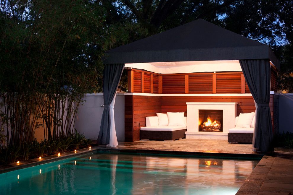 Modern Cabana for a Transitional Pool with a Wood Fence and Culbreath Isle Garden by David Conner + Associates