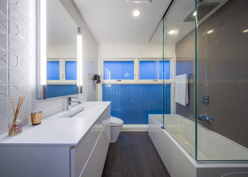 Mosa Tile for a Modern Bathroom with a Frosted Glass and Minneapoli Riverfront Mid Century Modern Remodel by Citydeskstudio, Inc.