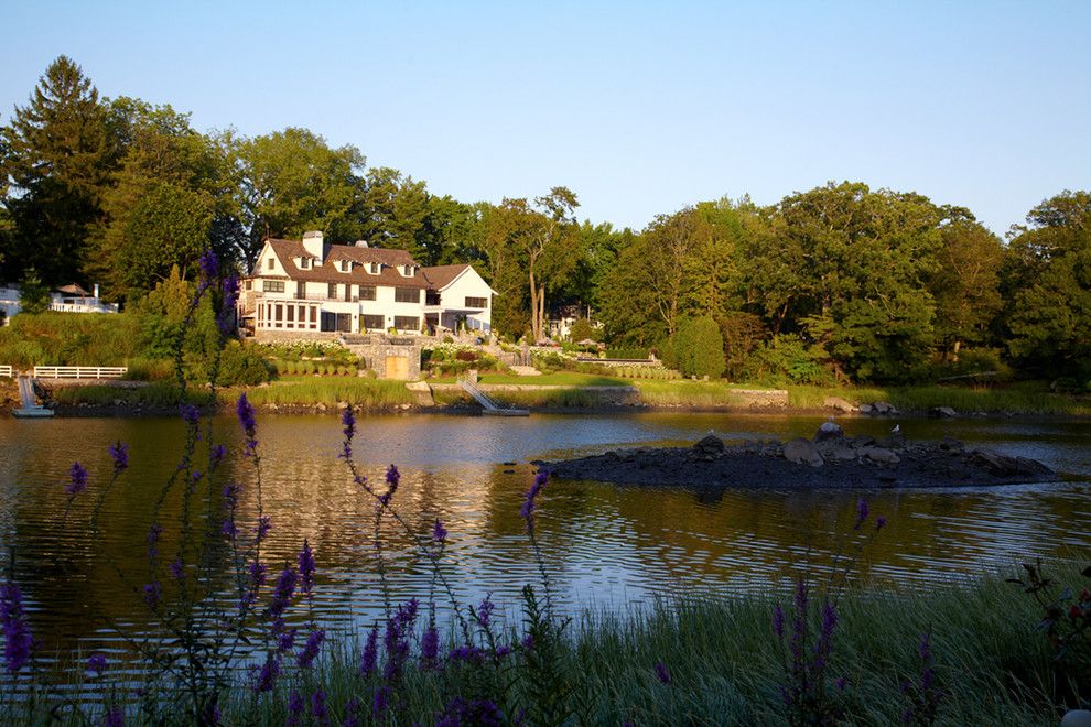 Mossy Oak Fence for a Transitional Exterior with a Waterfront and Greenwich Residence by Leap Architecture