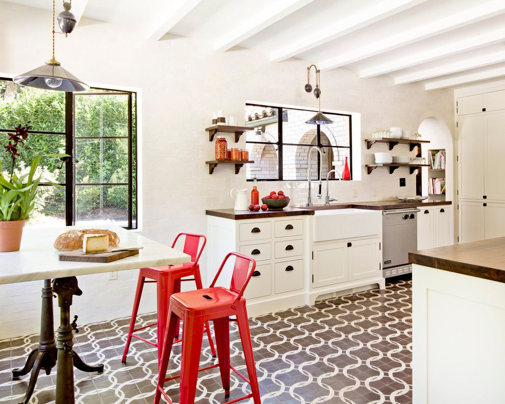 Mr Bar Stool for a Mediterranean Kitchen with a Walnut Counter and White Brick Mediterranean by Jessica Helgerson Interior Design