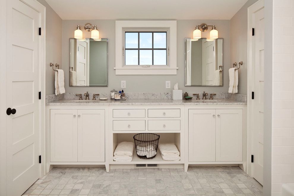 Muska Lighting for a Farmhouse Bathroom with a Basket and Holly Ridge Farmhouse by Sala Architects