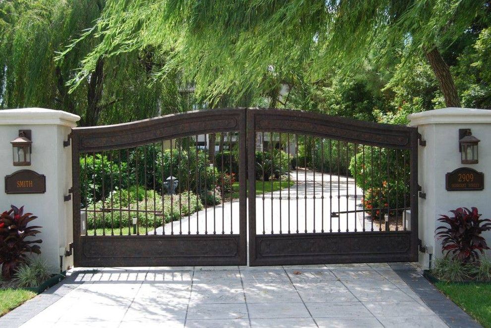 Natec for a Mediterranean Landscape with a Concrete Driveway and Residential Fence Projects by Fencemaster