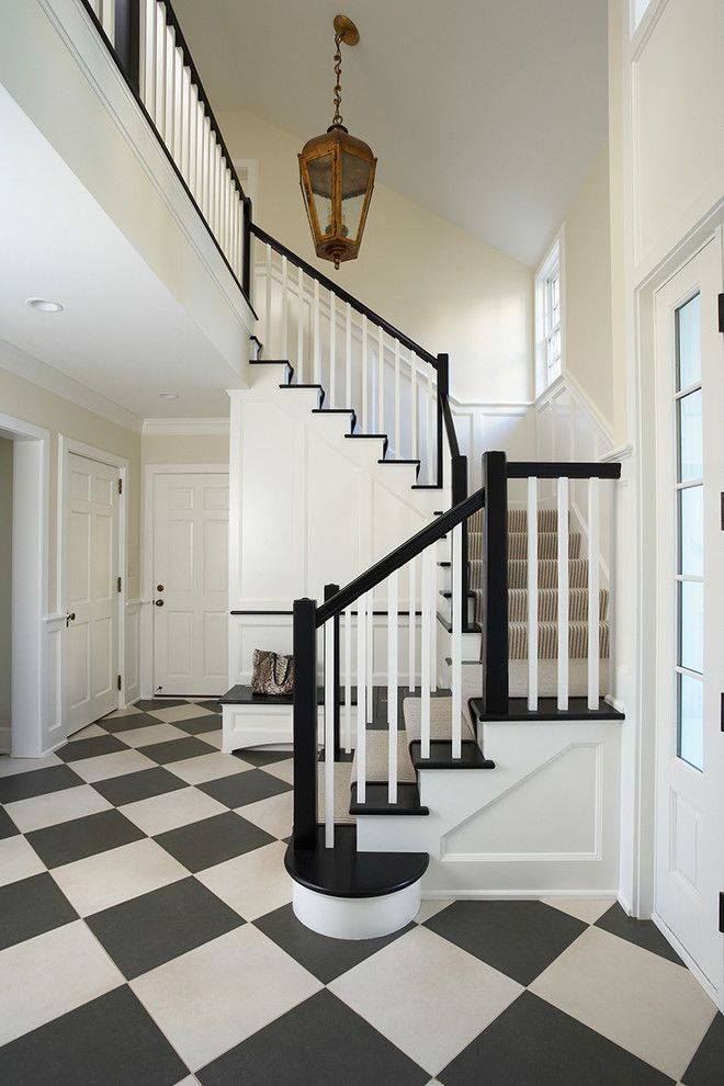 Navajo White Paint for a Traditional Entry with a Black and White Floor and Minnesota Private Residence by Cook Architectural Design Studio