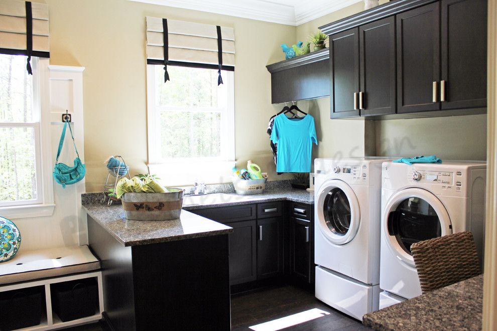 New Caledonia Granite for a Traditional Laundry Room with a Black and White Roman Shades and Laundry by E3 Cabinets & Design