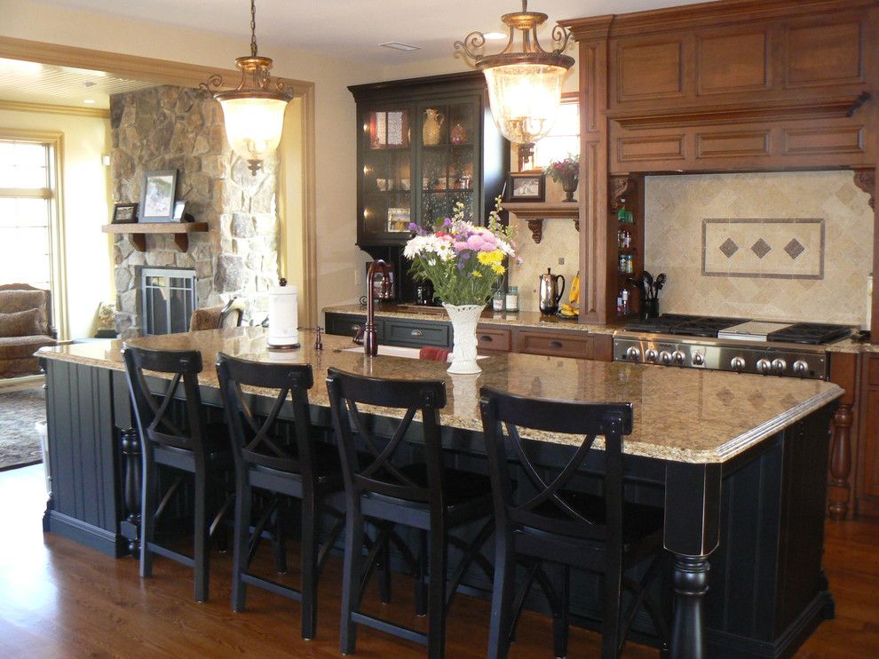 New Venetian Gold Granite for a Traditional Kitchen with a Black Cabinets and Granite by Stone Masters Inc