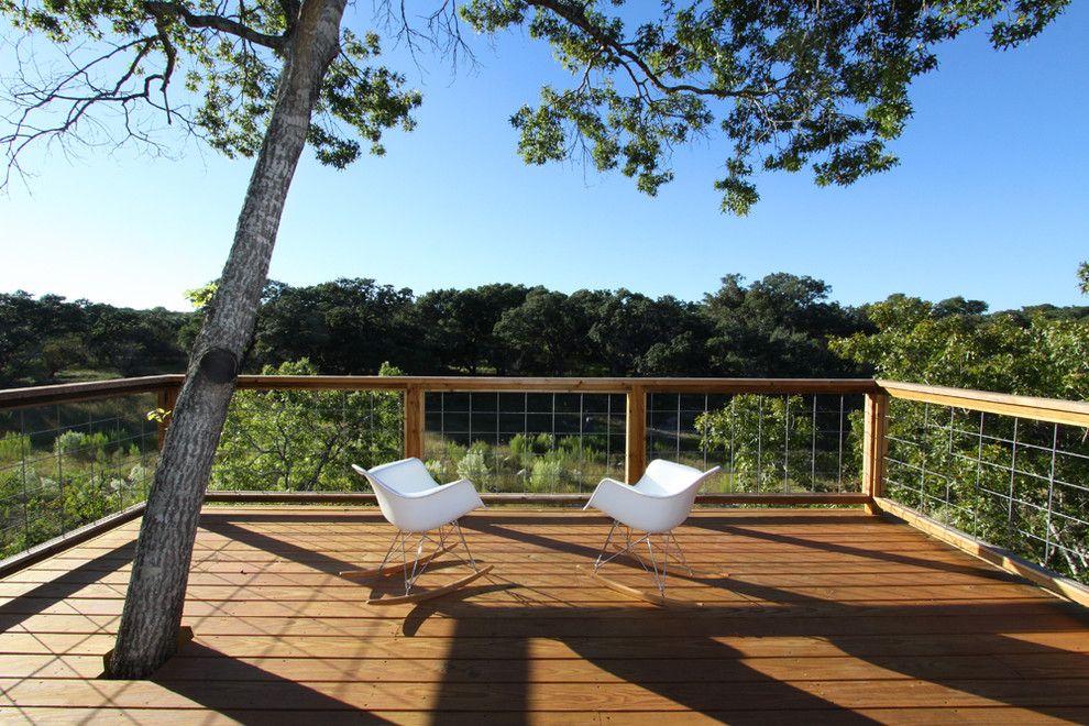 Nichols Lumber for a Modern Deck with a Tree in Deck and Pivot Pad, Ignacio Salas Humara Architect by Ignacio Salas Humara Architect Llc