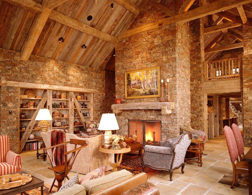 Nichols Lumber for a Rustic Family Room with a Cathedral Ceiling and Snake River Residence by Jlf & Associates, Inc.