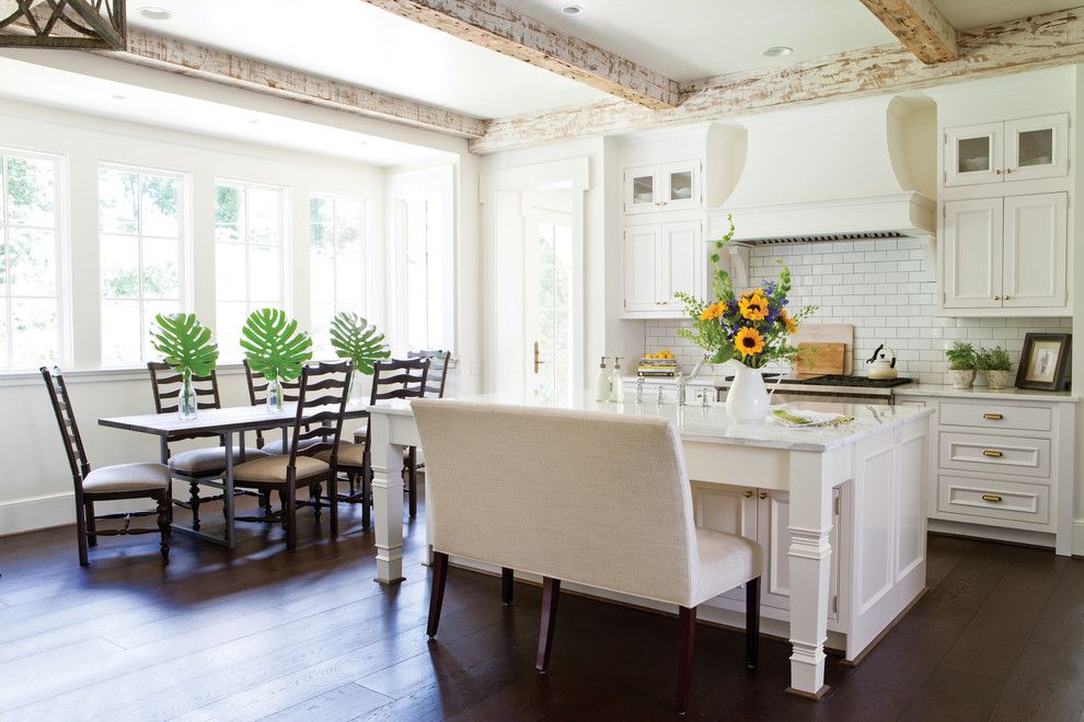 Ochre Lighting for a Traditional Kitchen with a Dining Bench and Wellborn Cabinet by Wellborn Cabinet, Inc.