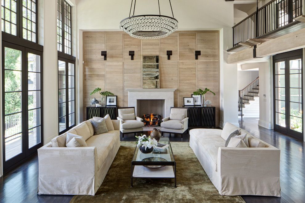 Ochre Lighting for a Traditional Living Room with a Armchairs and Lake Geneva Basswood by Michael Abraham Architecture