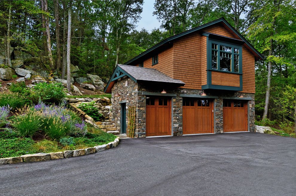 Oriel Window for a Rustic Garage with a Craftsman and Split Rock Timberpeg Lake Home by Evolve Design Group