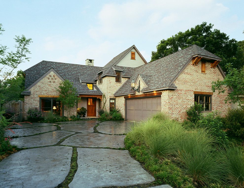 Owens Corning Cultured Stone for a Farmhouse Exterior with a Gray Fascia and Farmhouse by Michael Lyons Architect