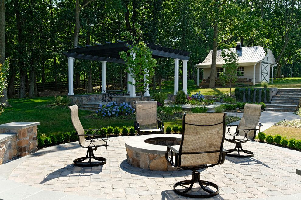 Owens Corning Cultured Stone for a Traditional Patio with a Seat Wall and Multi Room Rear Landscape by Inviting Spaces