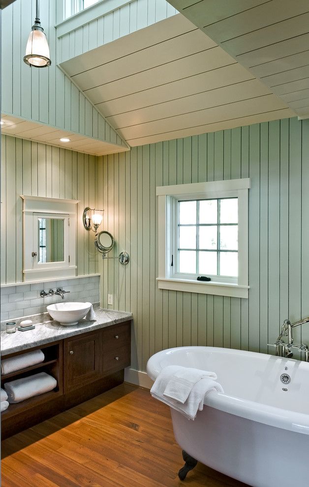 Painted Paneling for a Beach Style Bathroom with a Wood Ceiling and Bathroom by Whitten Architects