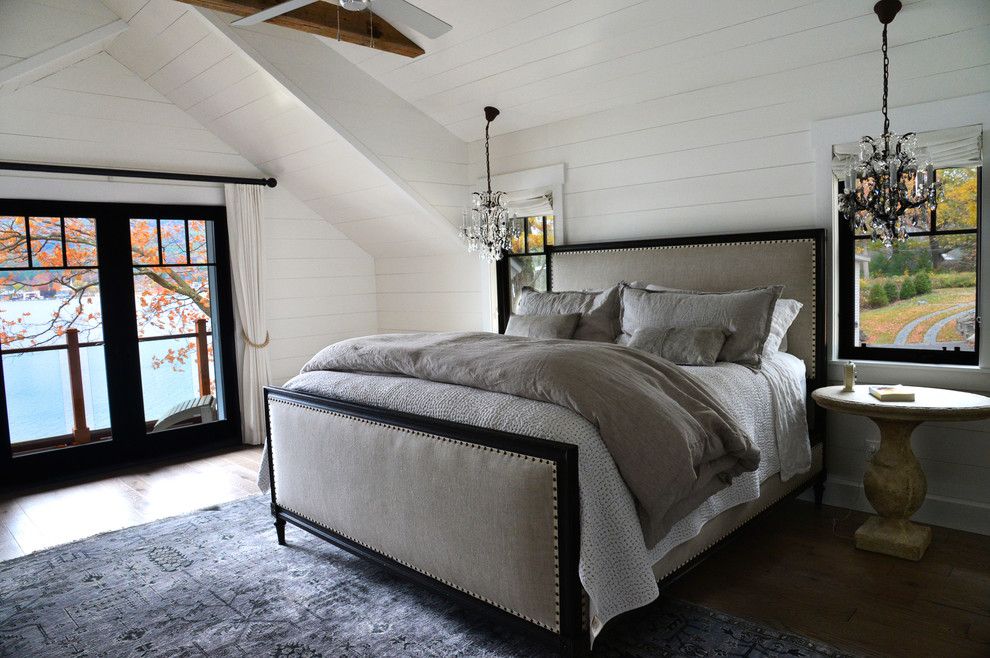 Painted Paneling for a Farmhouse Bedroom with a Sheepskin Rug and Lake Home by a Perfect Placement