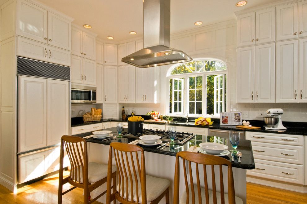 Painted Plywood Floors for a Traditional Kitchen with a Large Island Island Ventilation Tall Cabinets White Kitchen and Kitchen in a Mansion by Kitchen and Bath World, Inc