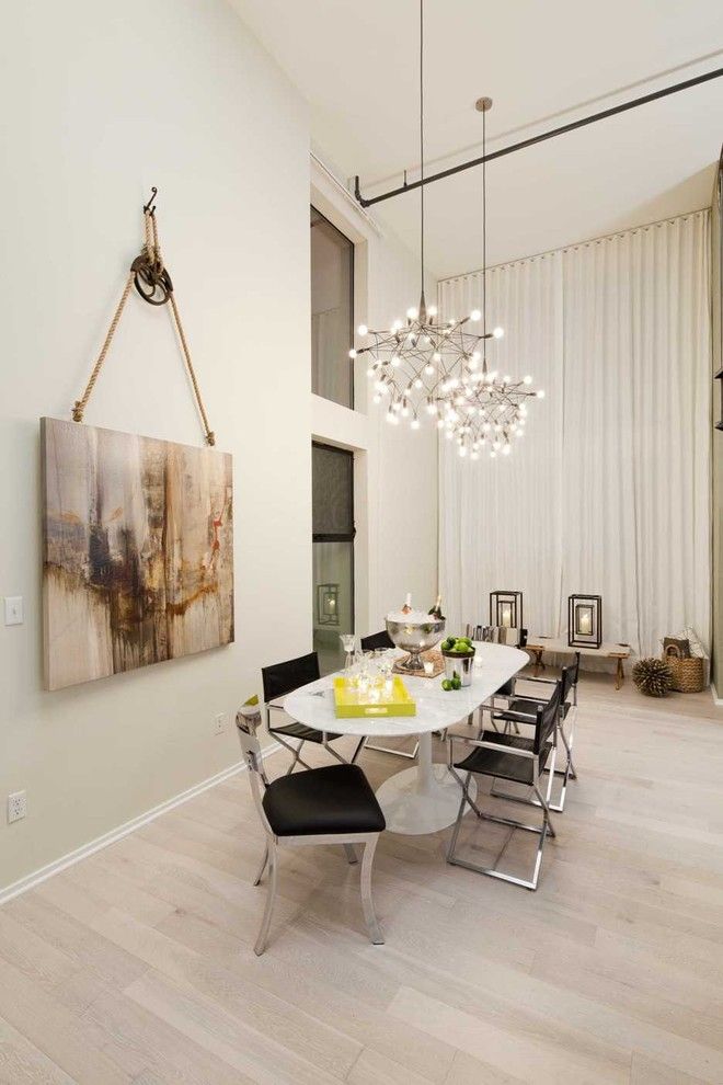 Painting Baseboards for a Contemporary Dining Room with a Oval Dining Table and Venice Loft by Susan Manrao Design