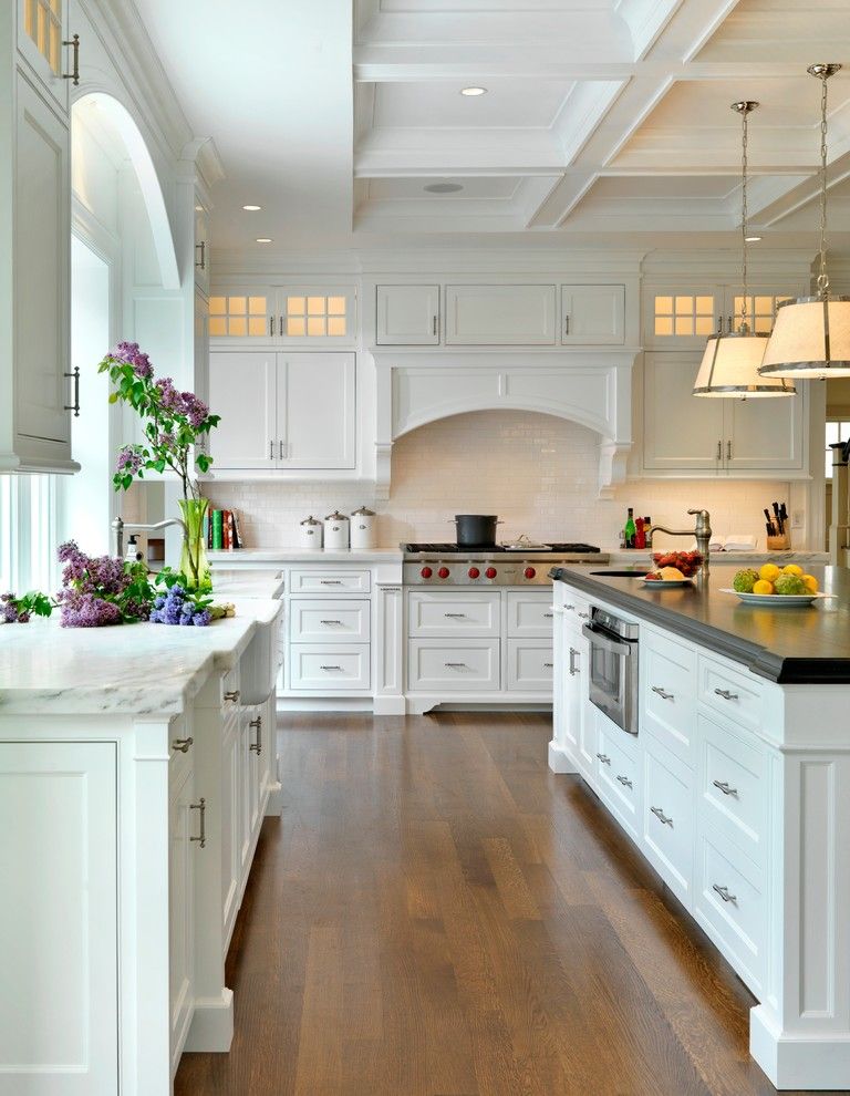 Painting Oak Cabinets for a Traditional Kitchen with a Island and Kitchens by Jan Gleysteen Architects, Inc