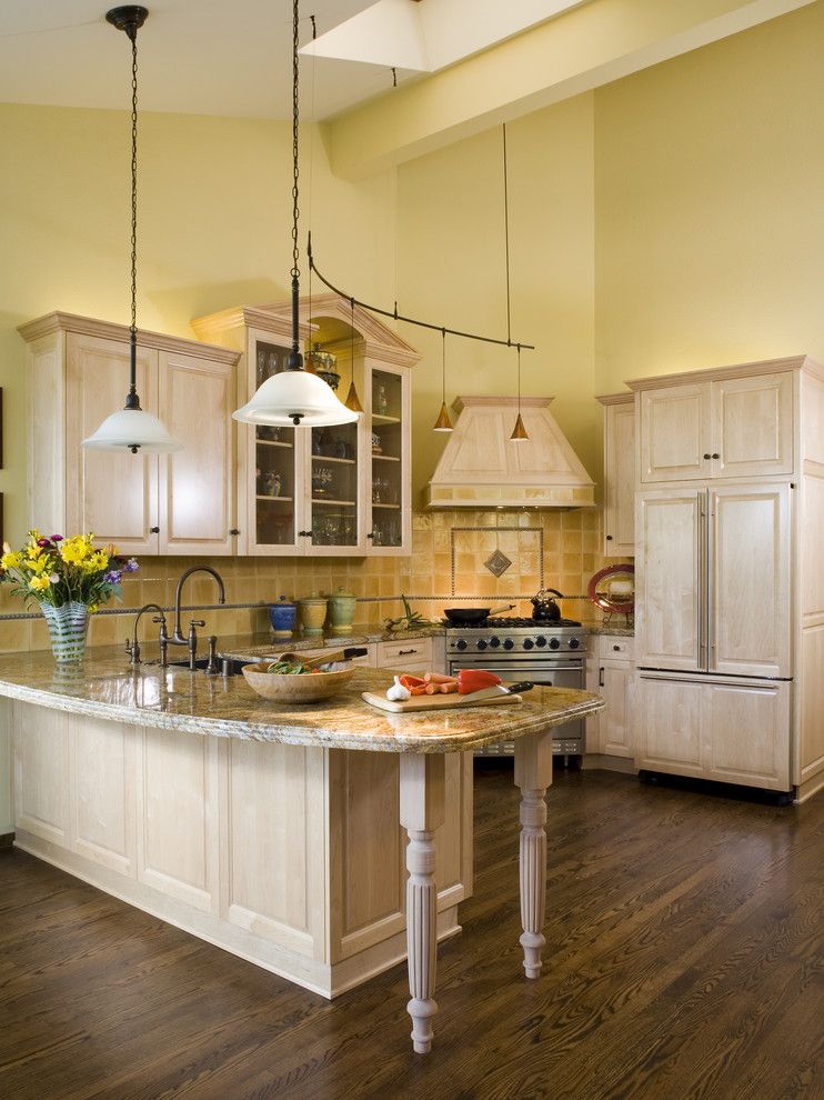 Painting Oak Cabinets for a Traditional Kitchen with a Refrigerator and Kitchen by Harrell Remodeling