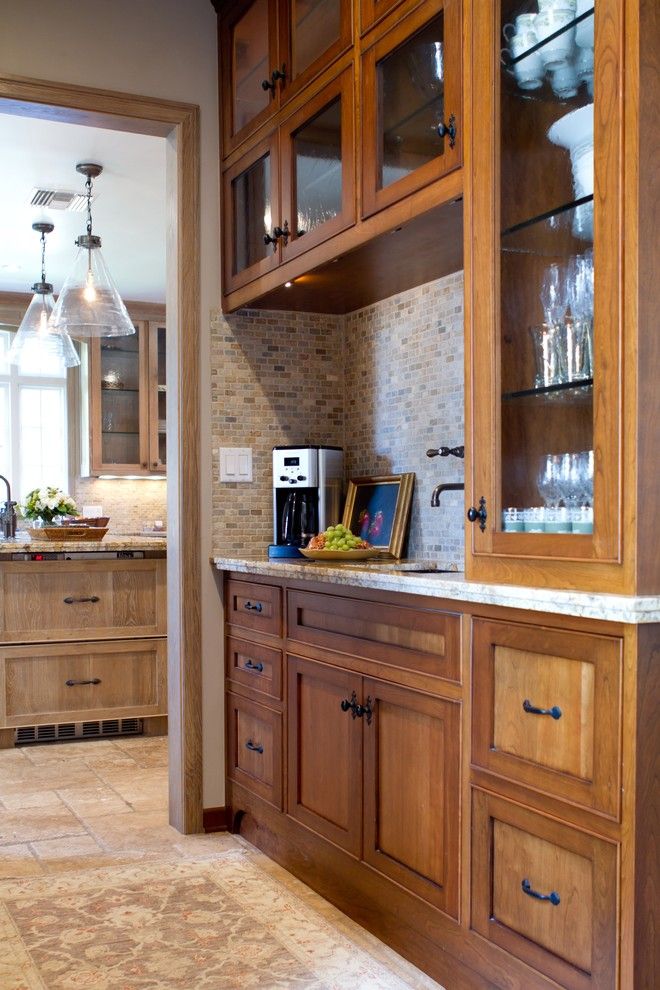 Painting Oak Cabinets for a Traditional Kitchen with a Travertine Floors and Charmean Neithart Interiors, Llc. by Charmean Neithart Interiors, Llc.