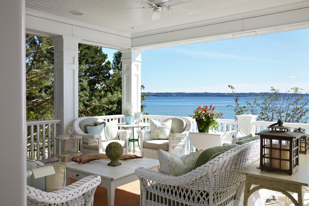 Painting Wicker Furniture for a Traditional Porch with a White Railing and Michigan Summer Home by Tom Stringer Design Partners