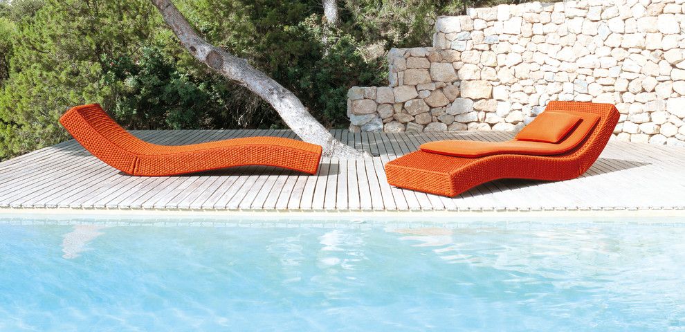 Paola Lenti for a Contemporary Pool with a Stone Retaining Wall and Xave Lounge Chair by Paola Lenti by Escale Design