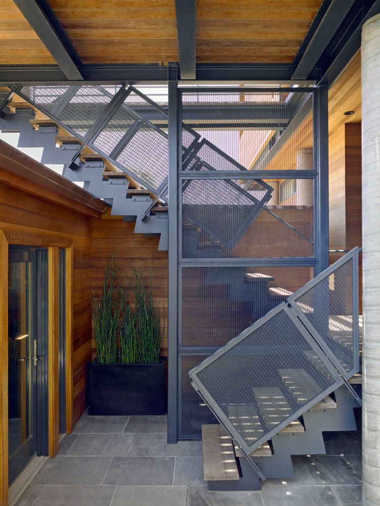 Parapet Wall for a Modern Staircase with a Blackened Steel and Stinson Beach House by Irwin Fisher, Inc.