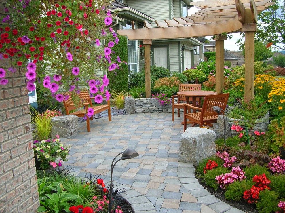 Paver Patterns for a Traditional Patio with a Wood Trellis and Poco by Pacifica Landscape Works Inc.