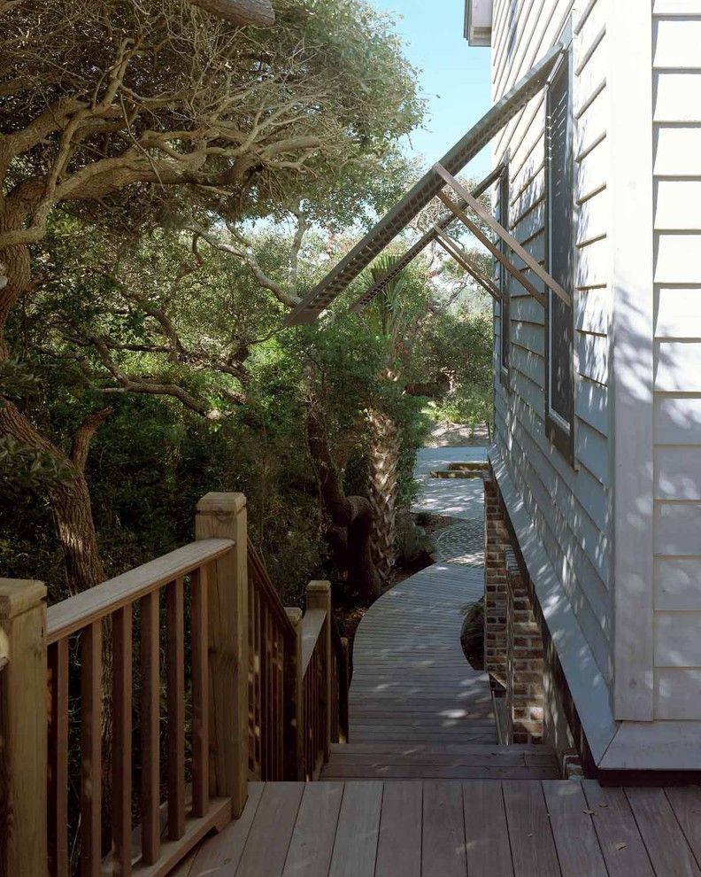 Pawleys Island Posh for a Beach Style Porch with a Curved Walkway and Pawleys Island Residence by Catalyst Architects, Llc