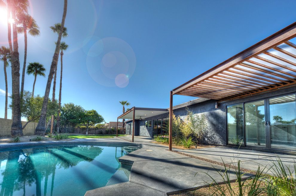 Pebbletec for a Southwestern Exterior with a Patio and Black House (Steinman Renovation) by Spry Architecture