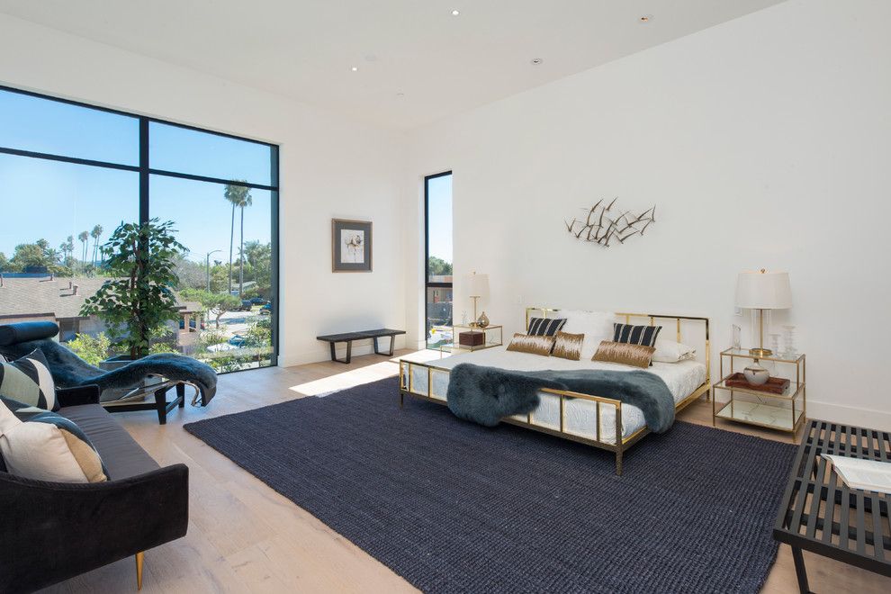 Petit Jean Properties for a Contemporary Bedroom with a Blue Area Rug and Venice Compound by Mk Properties