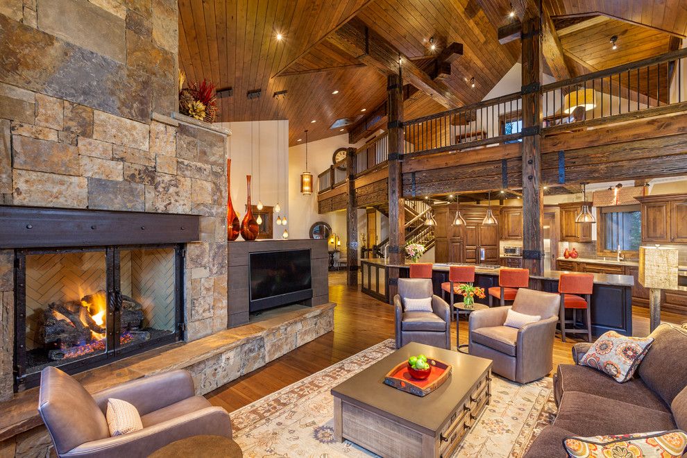 Pinnacle Homes for a Rustic Living Room with a Wood Ceiling and 282 Peerless Drive   Living Room by Pinnacle Mountain Homes