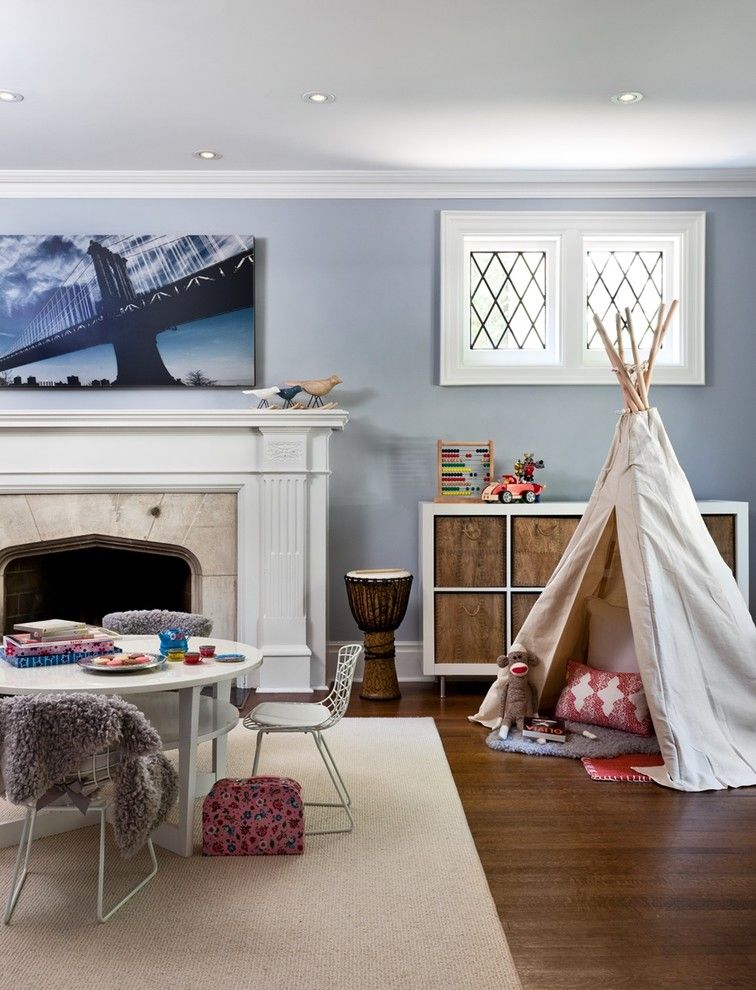 Playrooms for a Eclectic Kids with a Baskets and Chic Mid Town Playroom by Sara Bederman Design