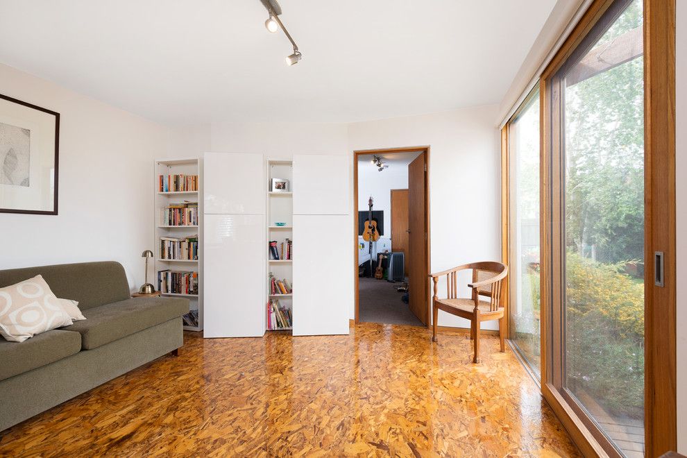 Plywood Flooring Ideas for a Contemporary Home Office with a Sliding Glass Doors and Northcote Studio by Statkus Architecture Pty Ltd