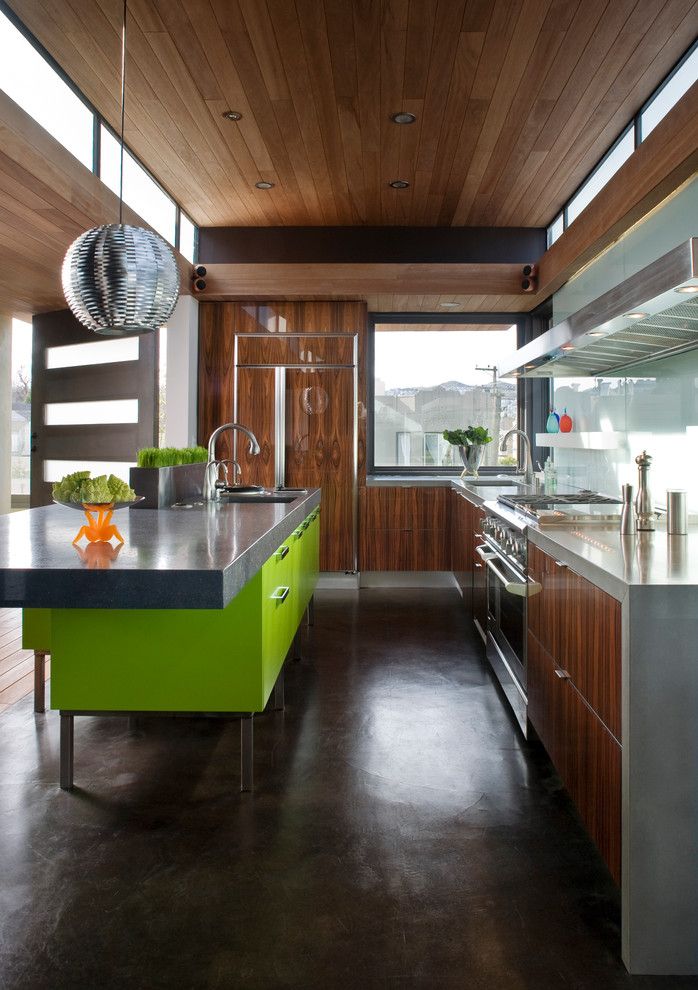 Polished Concrete Countertops for a Contemporary Kitchen with a Cooktop and Sunset Magazine Idea House by Livingston Interiors