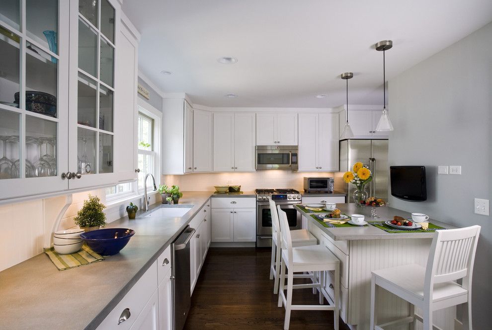 Polished Concrete Countertops for a Traditional Kitchen with a Glass Front Cabinets and Kitchen by Great Rooms Designers & Builders