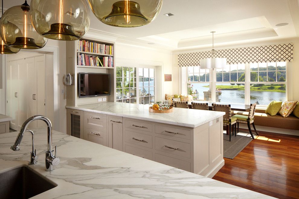 Polished Concrete Countertops for a Transitional Kitchen with a Bench Seating and Greenwich Residence by Leap Architecture