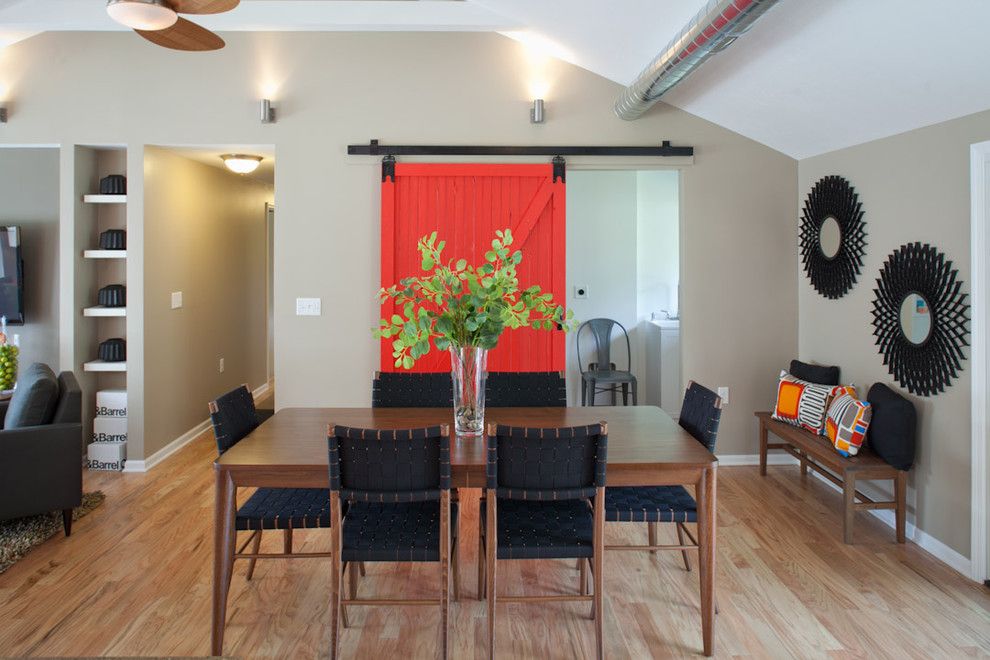 Porter Barn Wood for a Transitional Dining Room with a Bench Seat and Red Barn Door with Full View of Dining Table. by Nest Designs Llc