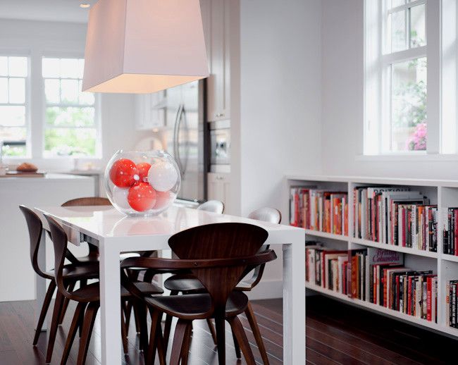 Portico Designs for a Modern Dining Room with a Library and Solo by Portico Design Group