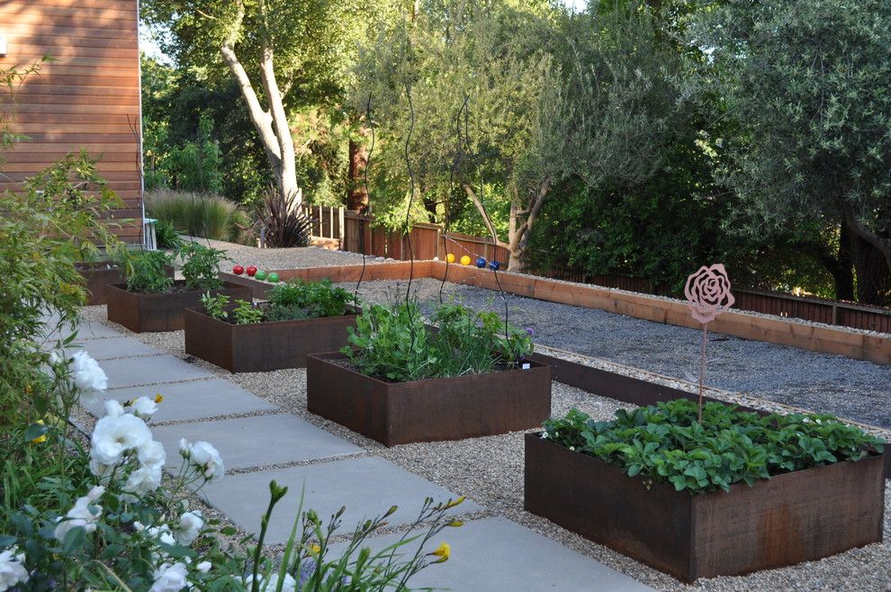 Potager Garden for a Contemporary Landscape with a Step and Bocce Ball Court by Huettl Landscape Architecture