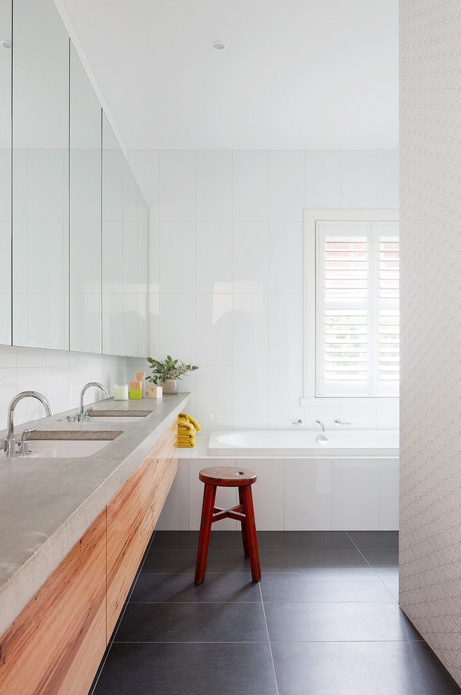 Poured Concrete Countertops for a Contemporary Bathroom with a Conceaeled Storage and Martin House by Bg Architecture