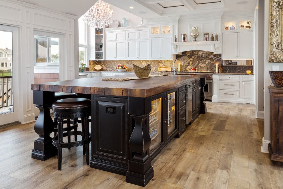 Poured Concrete Countertops for a Rustic Kitchen with a Raised Ceiling and Poured Concrete Countertop by Showcase Kitchens