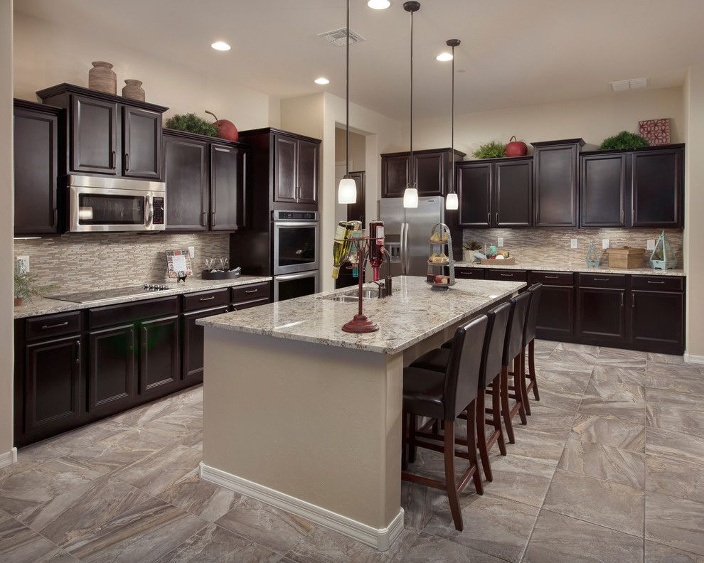 Precision Countertops for a Traditional Kitchen with a Leather Bar Stools and the Sabine Plan at Sky Ranch | Tucson, Az by Meritage Homes