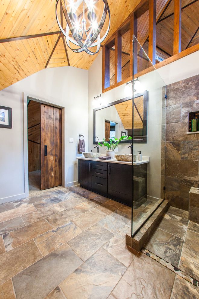 Probuild for a Rustic Bathroom with a Wood Ceiling and Bathroom: D.k. Residence by Pro Builders