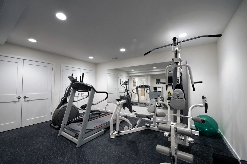 Prosource Flooring for a Contemporary Home Gym with a Moss Home Services and Award Winning Basement by Moss Building and Design