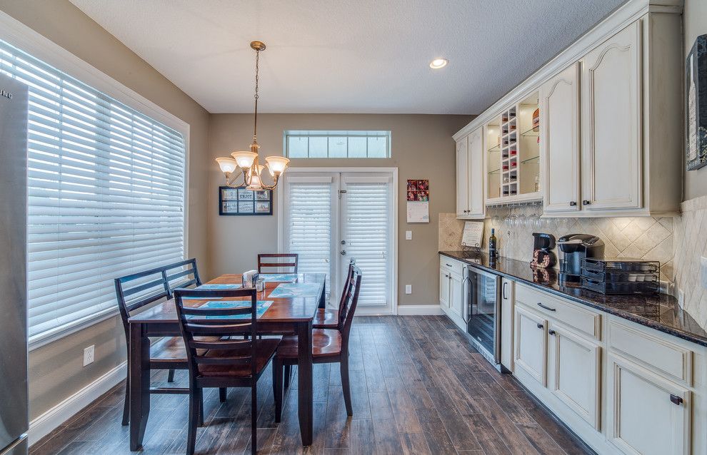 Prosource Orlando for a Transitional Spaces with a Custom Home Bar and Up Styled Kitchen by Dewine Design