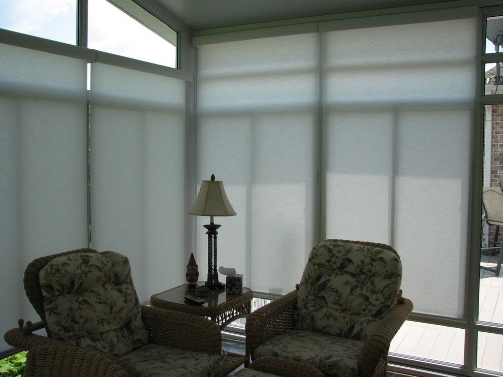 Qmotion for a Eclectic Sunroom with a Qmotion and Sunroom Motorized Solar Shades by Lightstyle Solutions