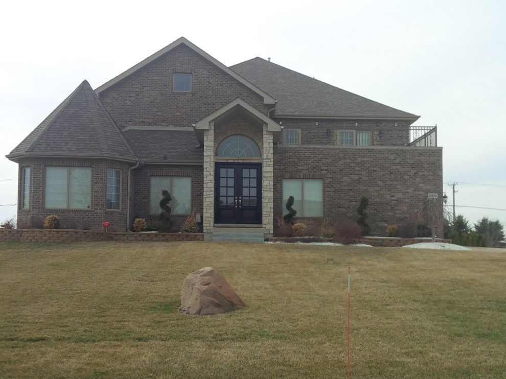 Quaker Windows for a Modern Exterior with a Roofing Gutters and Brand New Home Frankfort, Il by Chicagoland Builders