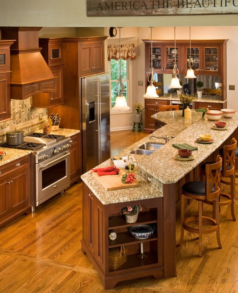 Quartz vs Granite Countertops for a Traditional Kitchen with a Large Island Granite Counter Tops Pass Thru Wall Hutch Hardw and Total Kitchen Renovation by Kitchen and Bath World, Inc