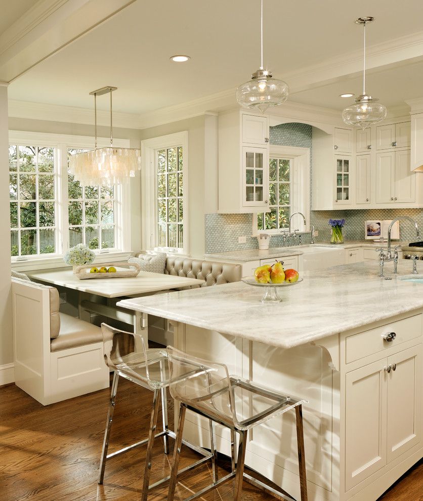 Quartzite vs Granite for a Traditional Kitchen with a White Kitchen and Green with Envy: Leed Certified Whole House Renovation by Harry Braswell Inc.